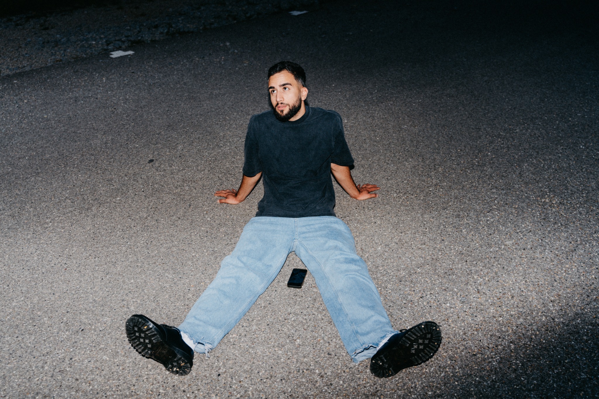 Metin Han photographed outdoors at night